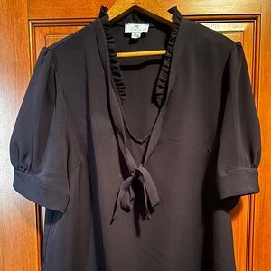 Navy blue blouse with shirred collar and tie detail